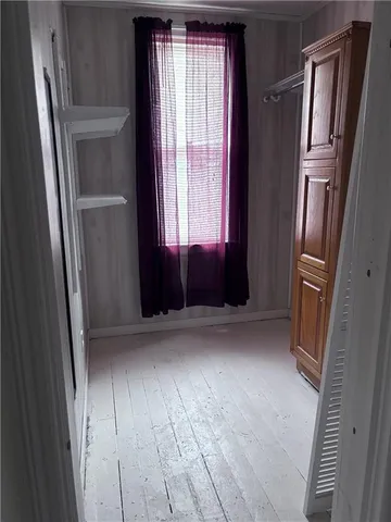 a view of empty room with front door