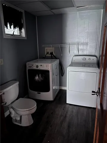 a bathroom with a toilet and a sink