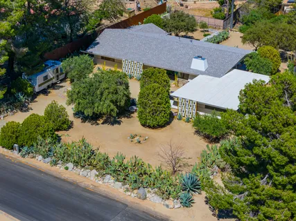 an aerial view of residential house with an outdoor space
