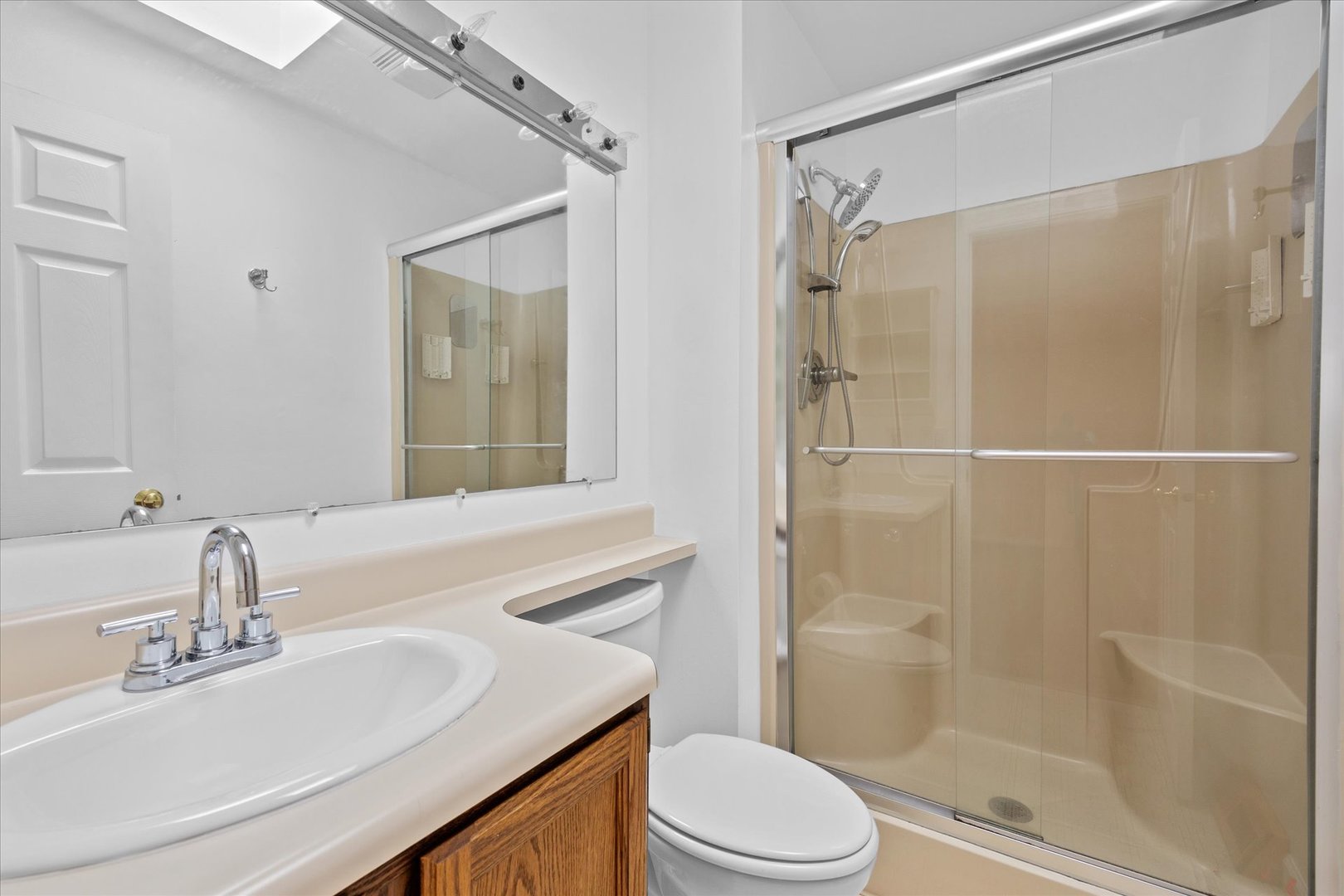 31 Evergreen Road Streamwood, IL 60107 - Photo 13 of 22 a bathroom with a sink toilet and shower