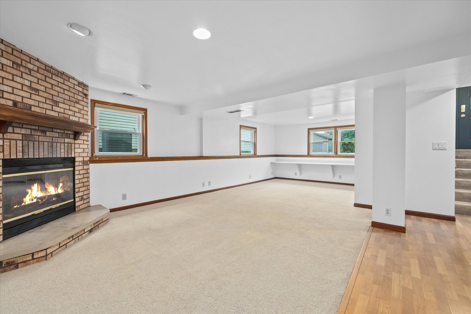 31 Evergreen Road Streamwood, IL 60107 - Photo 14 of 22 an empty room with windows and fireplace