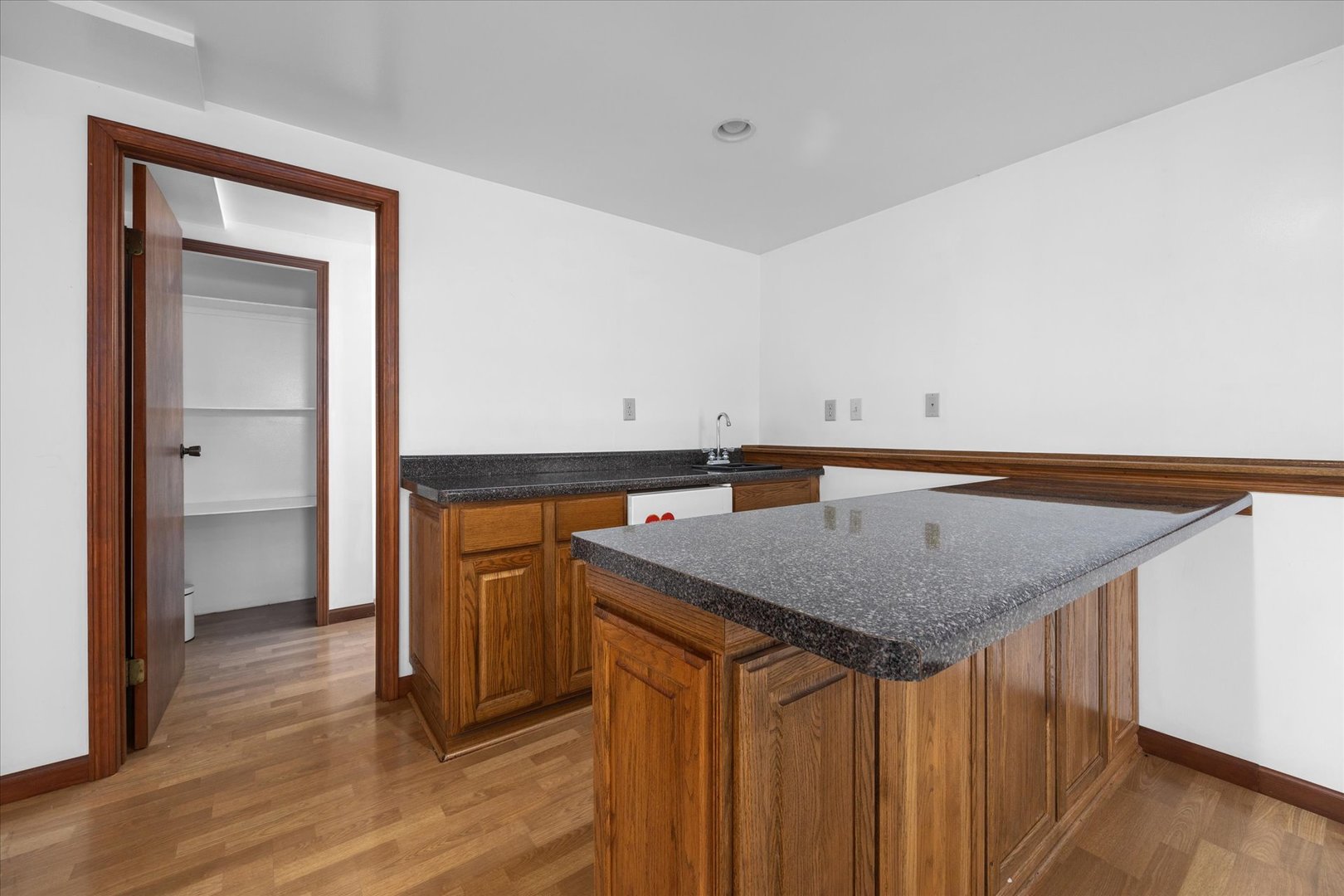 31 Evergreen Road Streamwood, IL 60107 - Photo 15 of 22 a kitchen with a sink a stove and a refrigerator