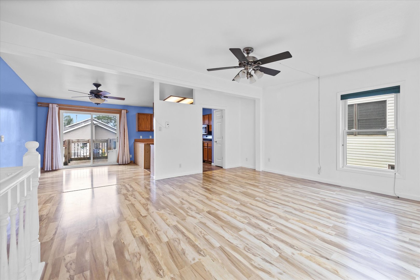 31 Evergreen Road Streamwood, IL 60107 - Photo 2 of 22 a view of empty room with wooden floor and fan