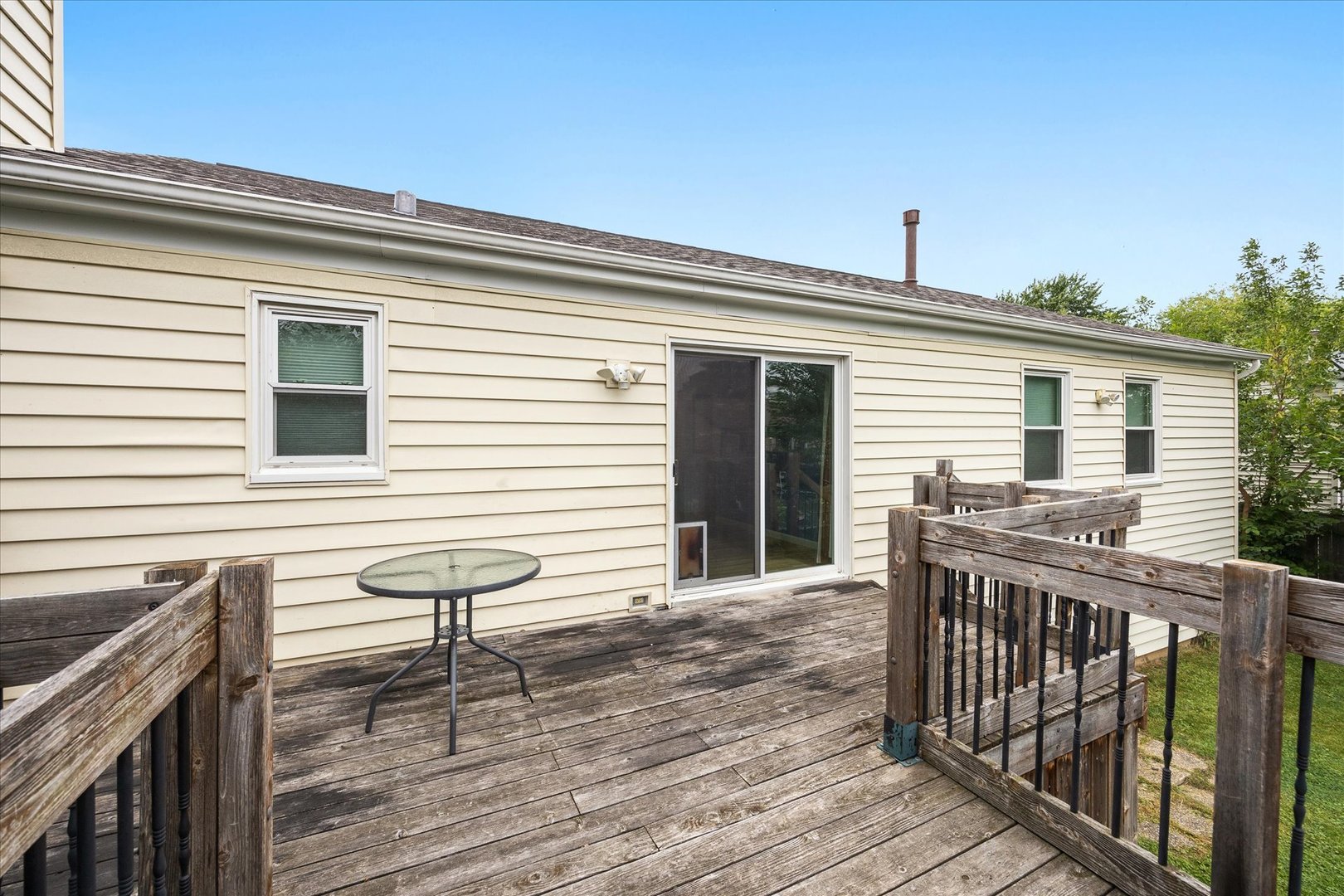 31 Evergreen Road Streamwood, IL 60107 - Photo 21 of 22 a view of a deck with wooden floor and fence