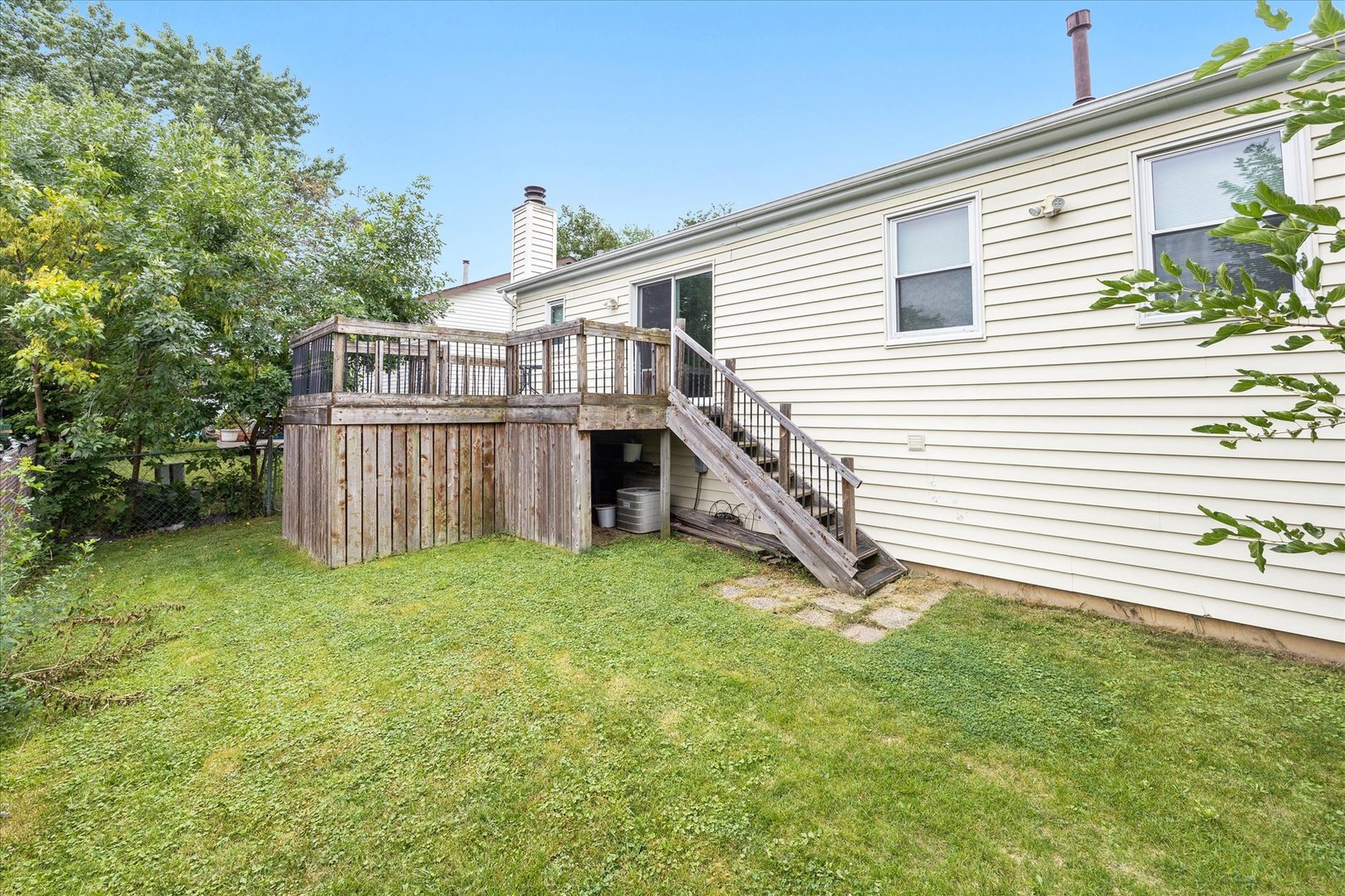 31 Evergreen Road Streamwood, IL 60107 - Photo 22 of 22 a view of a house with backyard and deck