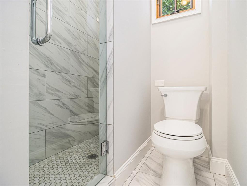 74 Boulevard Southeast Atlanta, GA 30312 - Photo 9 of 11 a white toilet sitting next to a shower