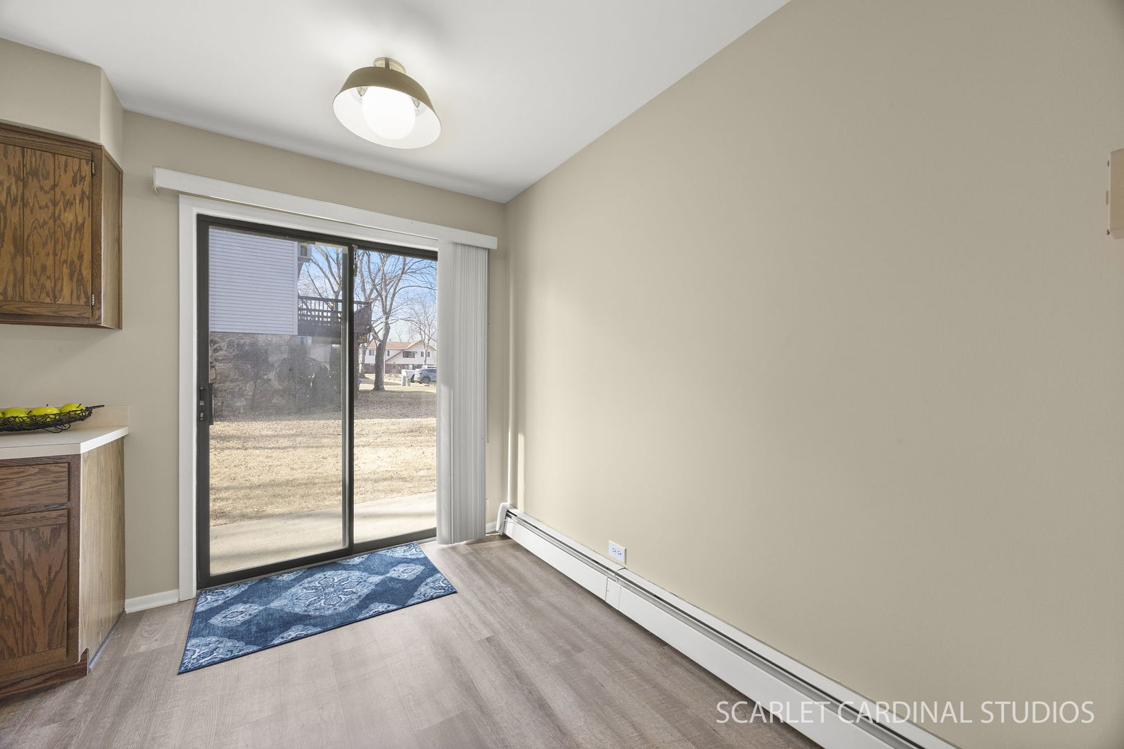 465 Echo Lane, Unit 2 Aurora, IL 60504 - Photo 12 of 12 a view of an empty room and window with wooden floor
