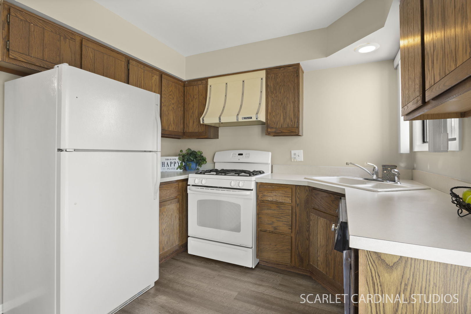 465 Echo Lane, Unit 2 Aurora, IL 60504 - Photo 5 of 12 a white refrigerator freezer sitting inside of a kitchen
