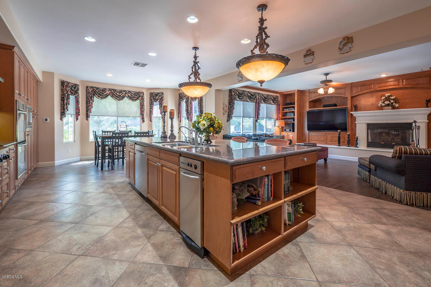 782 Running Creek Simi Valley, CA 93065 - Photo 14 of 49 a kitchen with stainless steel appliances granite countertop a stove oven and a view of dining room