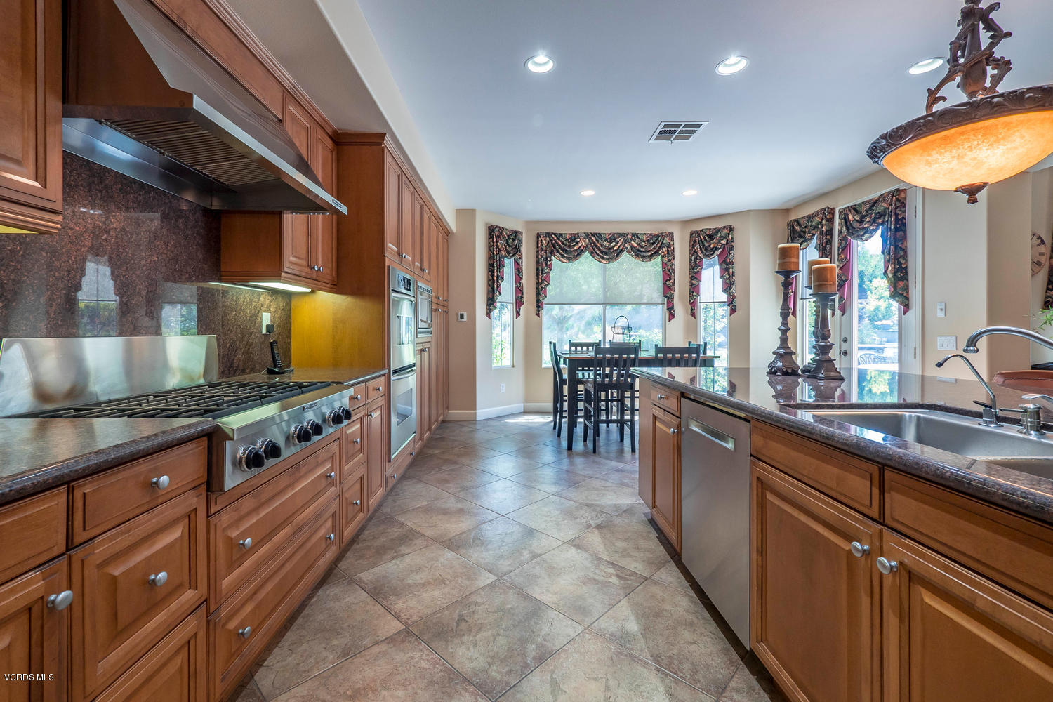 782 Running Creek Simi Valley, CA 93065 - Photo 15 of 49 a kitchen with stainless steel appliances granite countertop sink stove and cabinets
