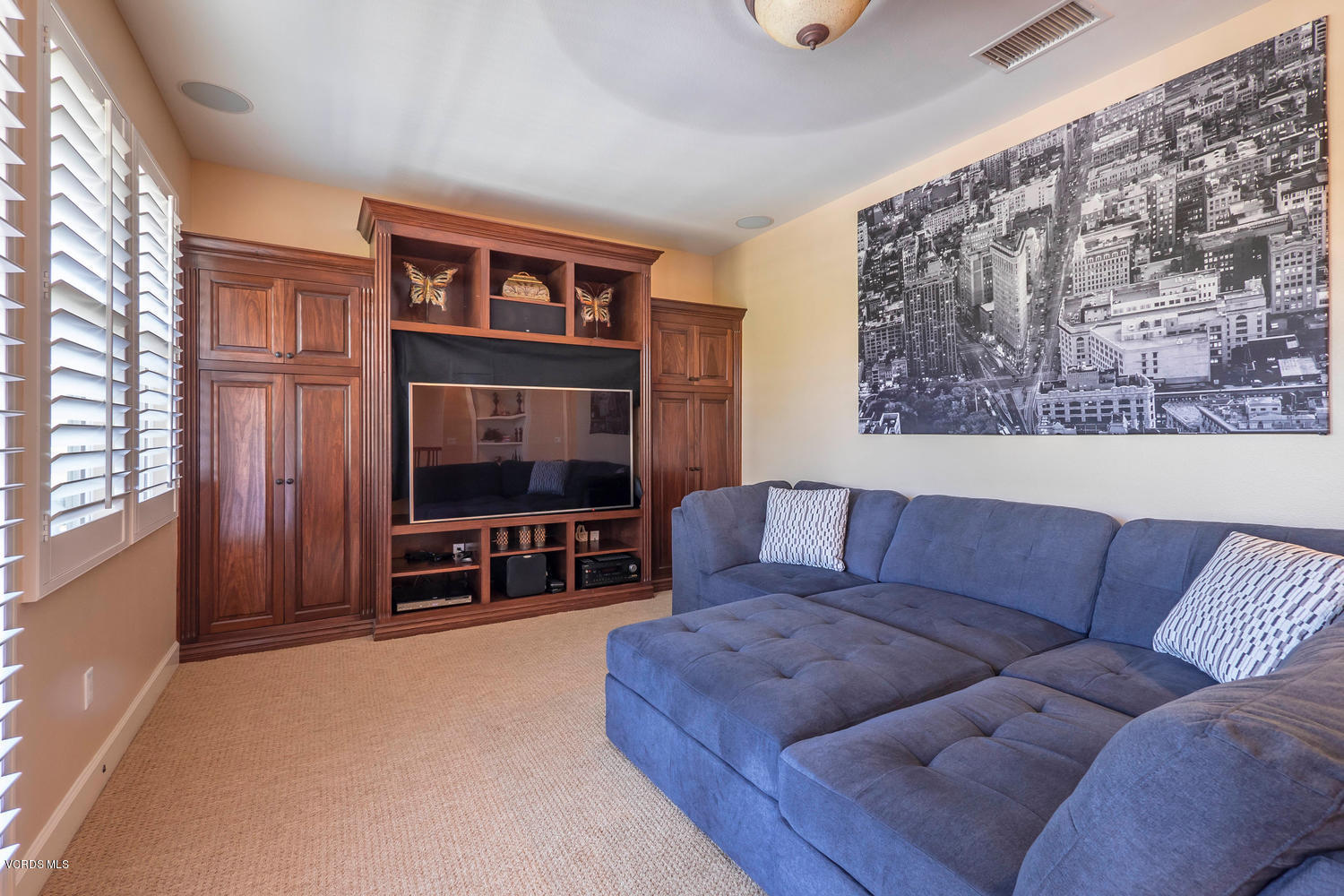782 Running Creek Simi Valley, CA 93065 - Photo 25 of 49 a living room with furniture and a flat screen tv