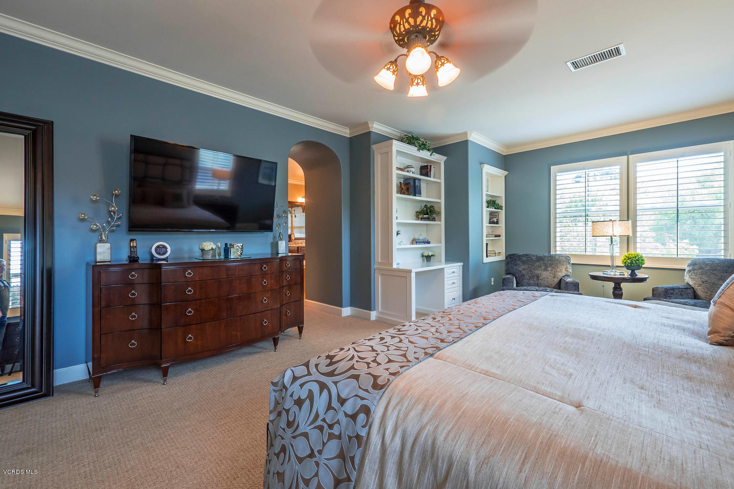 782 Running Creek Simi Valley, CA 93065 - Photo 28 of 49 a spacious bedroom with a bed and a flat screen television