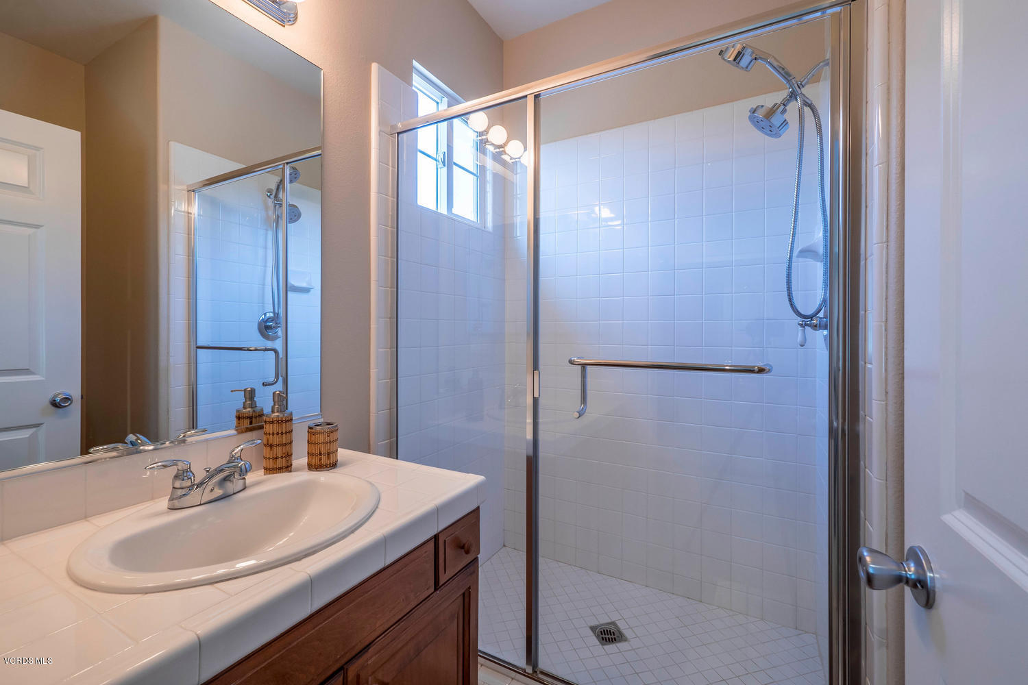 782 Running Creek Simi Valley, CA 93065 - Photo 35 of 49 a bathroom with a sink shower and a mirror