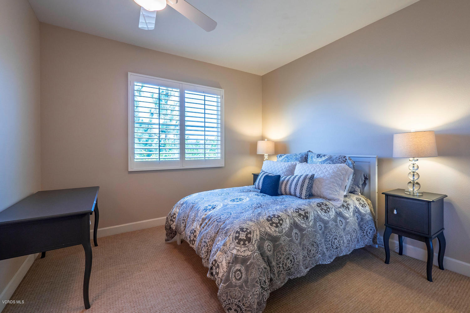 782 Running Creek Simi Valley, CA 93065 - Photo 36 of 49 a bedroom with a bed a lamp and a window