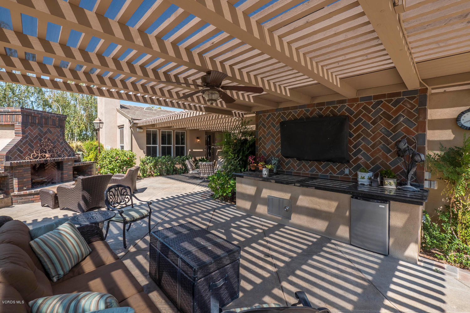 782 Running Creek Simi Valley, CA 93065 - Photo 40 of 49 a view of a patio with table and chairs potted plants and wooden floor