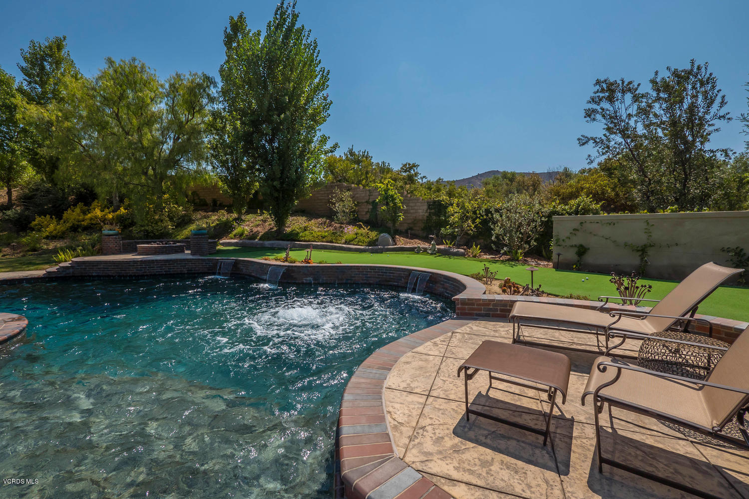 782 Running Creek Simi Valley, CA 93065 - Photo 45 of 49 a view of a wooden chairs and fire pit in the backyard