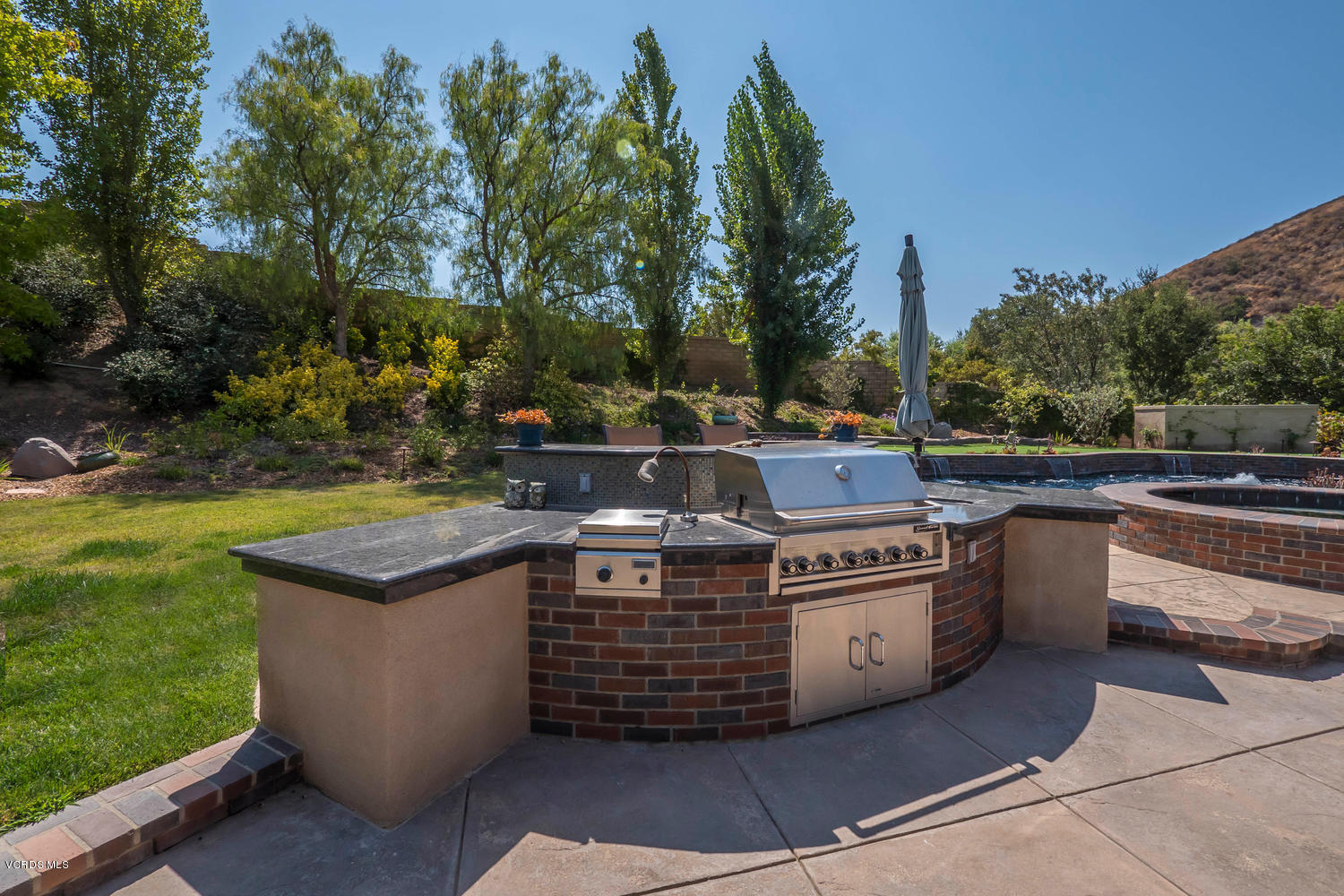 782 Running Creek Simi Valley, CA 93065 - Photo 47 of 49 a view of a kitchen with a sink and a stove
