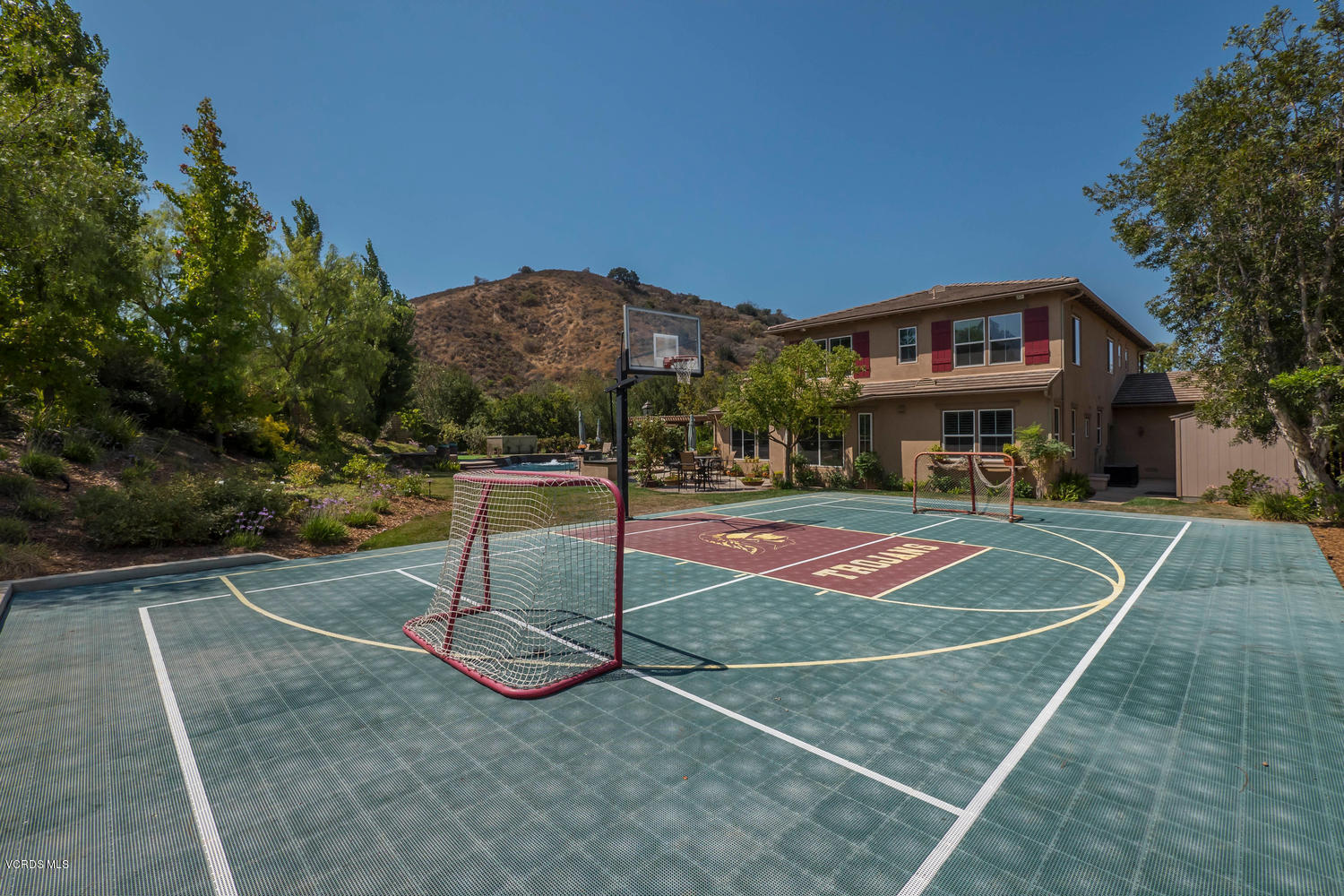 782 Running Creek Simi Valley, CA 93065 - Photo 48 of 49 a view of a tennis ground with large trees