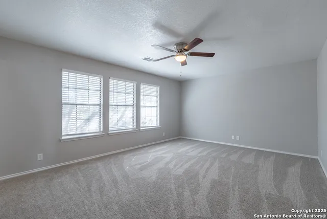 a view of empty room with windows