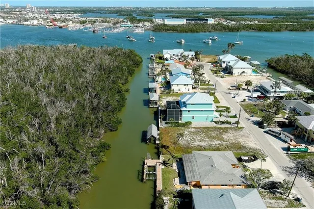 an aerial view of a house with a lake view