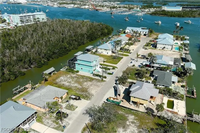 an aerial view of a house with a lake view