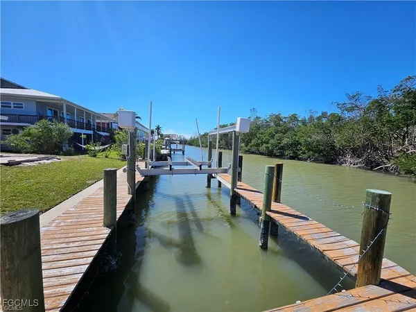 a view of a lake with outdoor seating