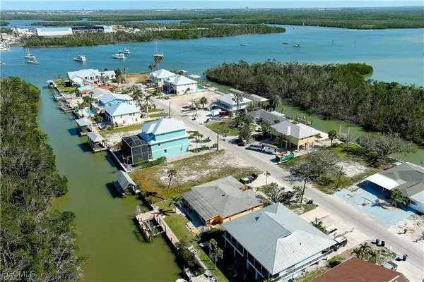 an aerial view of a house with a lake view