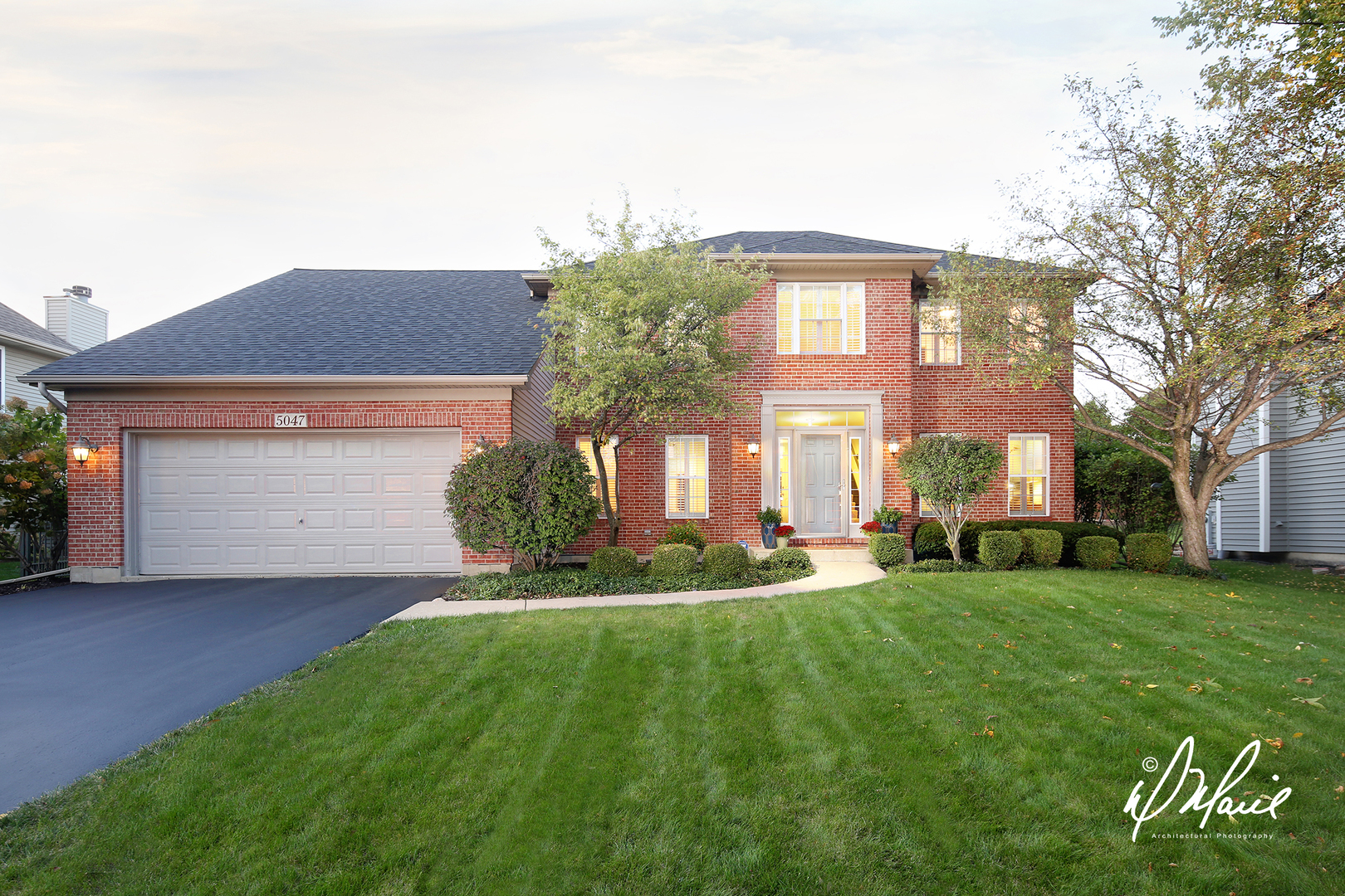 5047 Prairie Sage Lane Naperville, IL 60564 - Photo 1 of 22 a front view of a house with a yard
