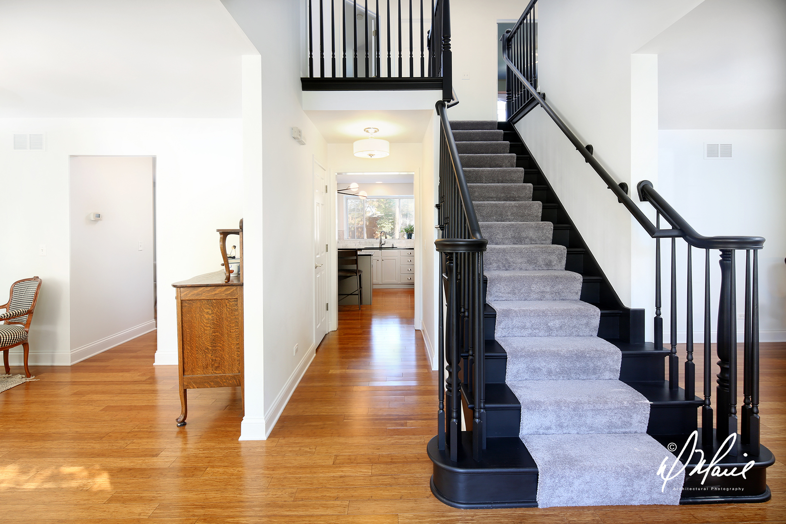 5047 Prairie Sage Lane Naperville, IL 60564 - Photo 2 of 22 a view of a hallway with wooden floor and staircase
