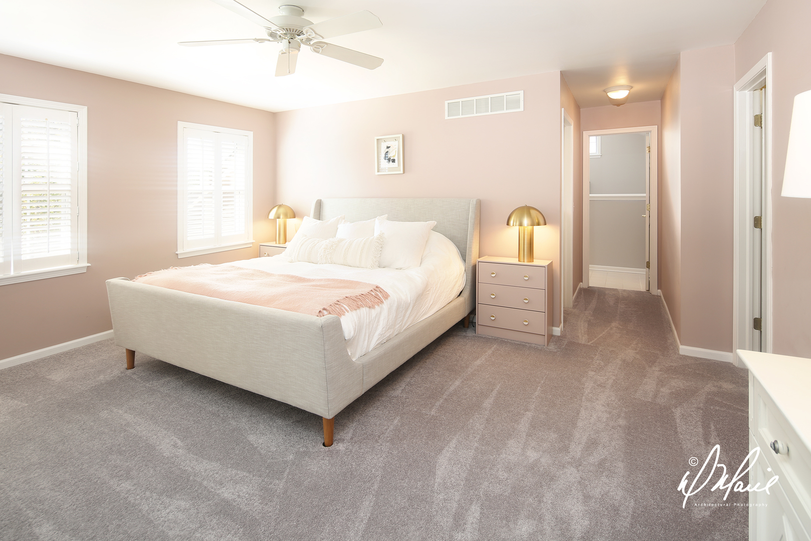 5047 Prairie Sage Lane Naperville, IL 60564 - Photo 12 of 22 a spacious bedroom with a bed and a chandelier