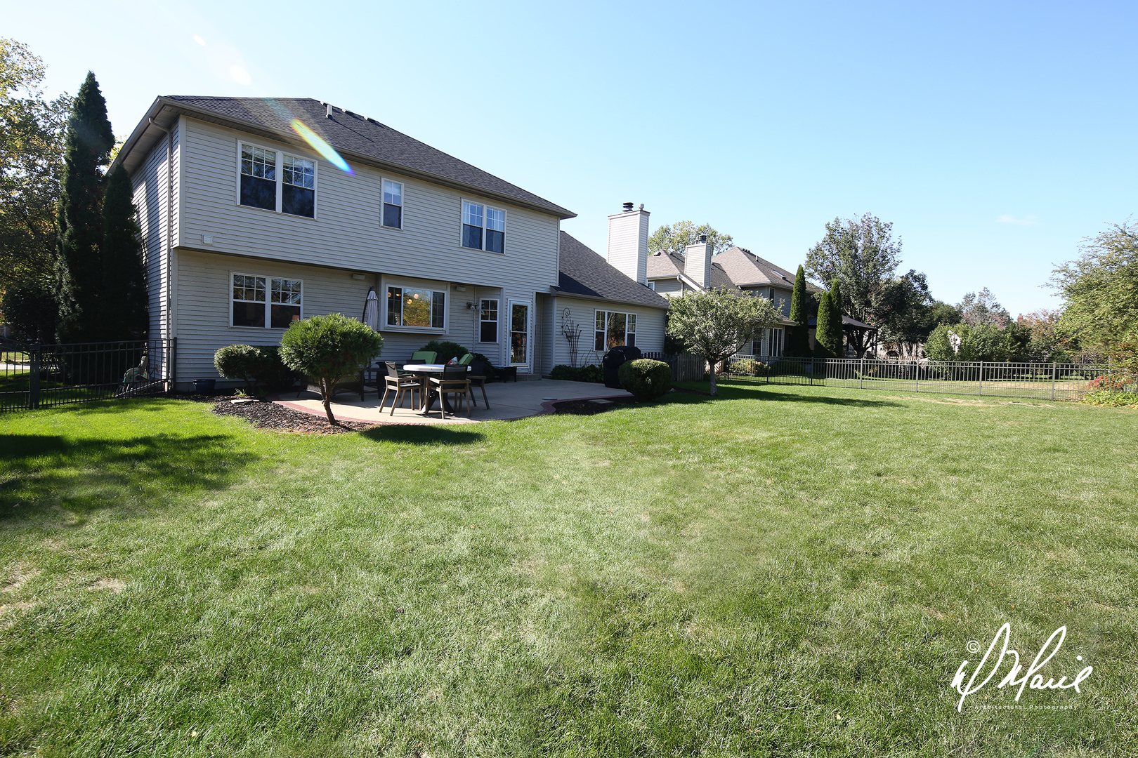 5047 Prairie Sage Lane Naperville, IL 60564 - Photo 22 of 22 a front view of a building with a garden