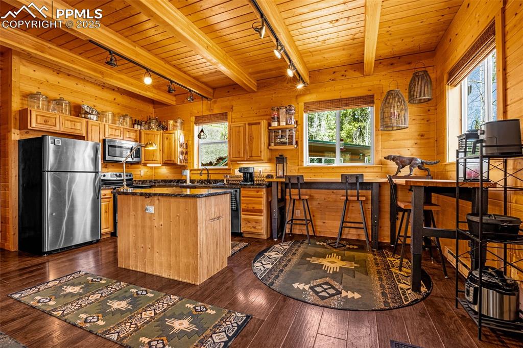 325 Willow Road Divide, CO 80814 - Photo 8 of 45 a view of a dining room with furniture window and wooden floor