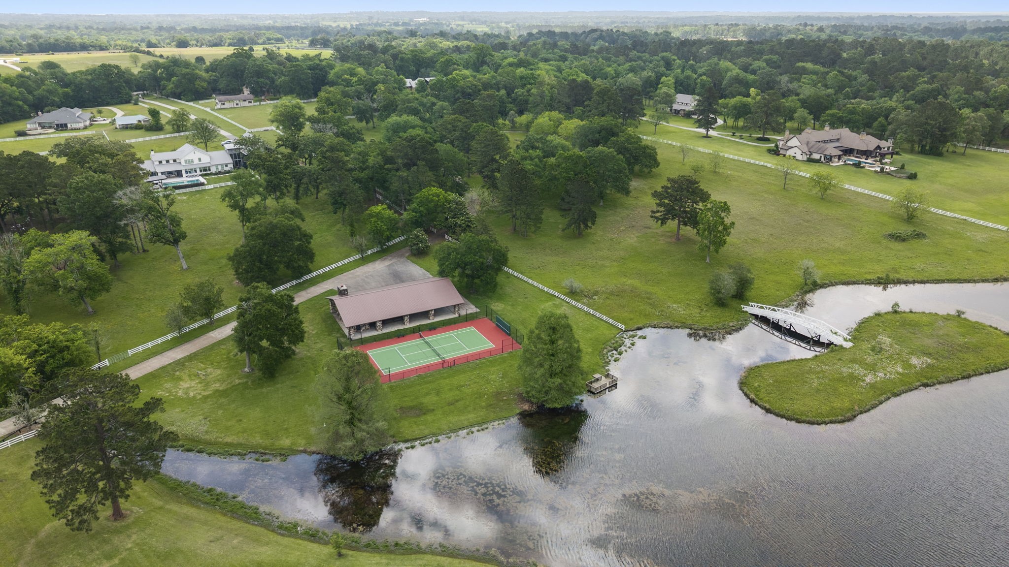 2242 Spring Branch Road Montgomery, TX 77316 - Photo 40 of 44 Perfection Ranch lakeside pavilion and tennis court, steps away from property’s easement
