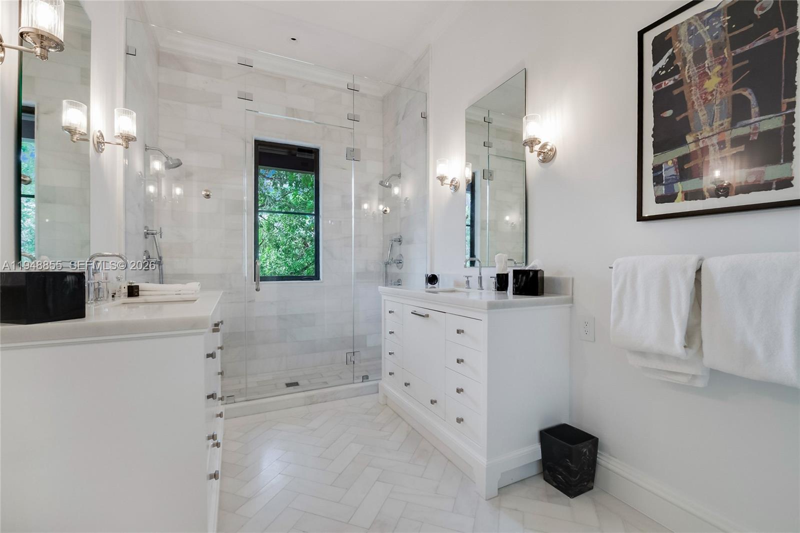 2615 Anderson Road Coral Gables, FL 33134 - Photo 17 of 28 a bathroom with a double vanity sink mirror and shower