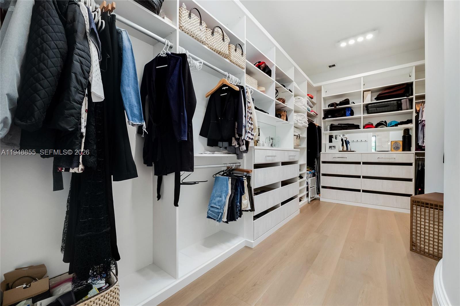 2615 Anderson Road Coral Gables, FL 33134 - Photo 18 of 28 a view of walk in closet with clothes and shoes