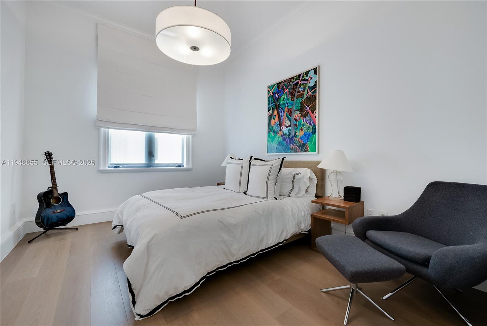 2615 Anderson Road Coral Gables, FL 33134 - Photo 19 of 28 a bedroom with a bed and a chandelier