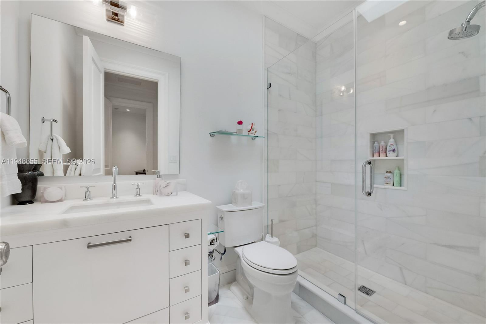 2615 Anderson Road Coral Gables, FL 33134 - Photo 21 of 28 a bathroom with a sink a toilet and shower