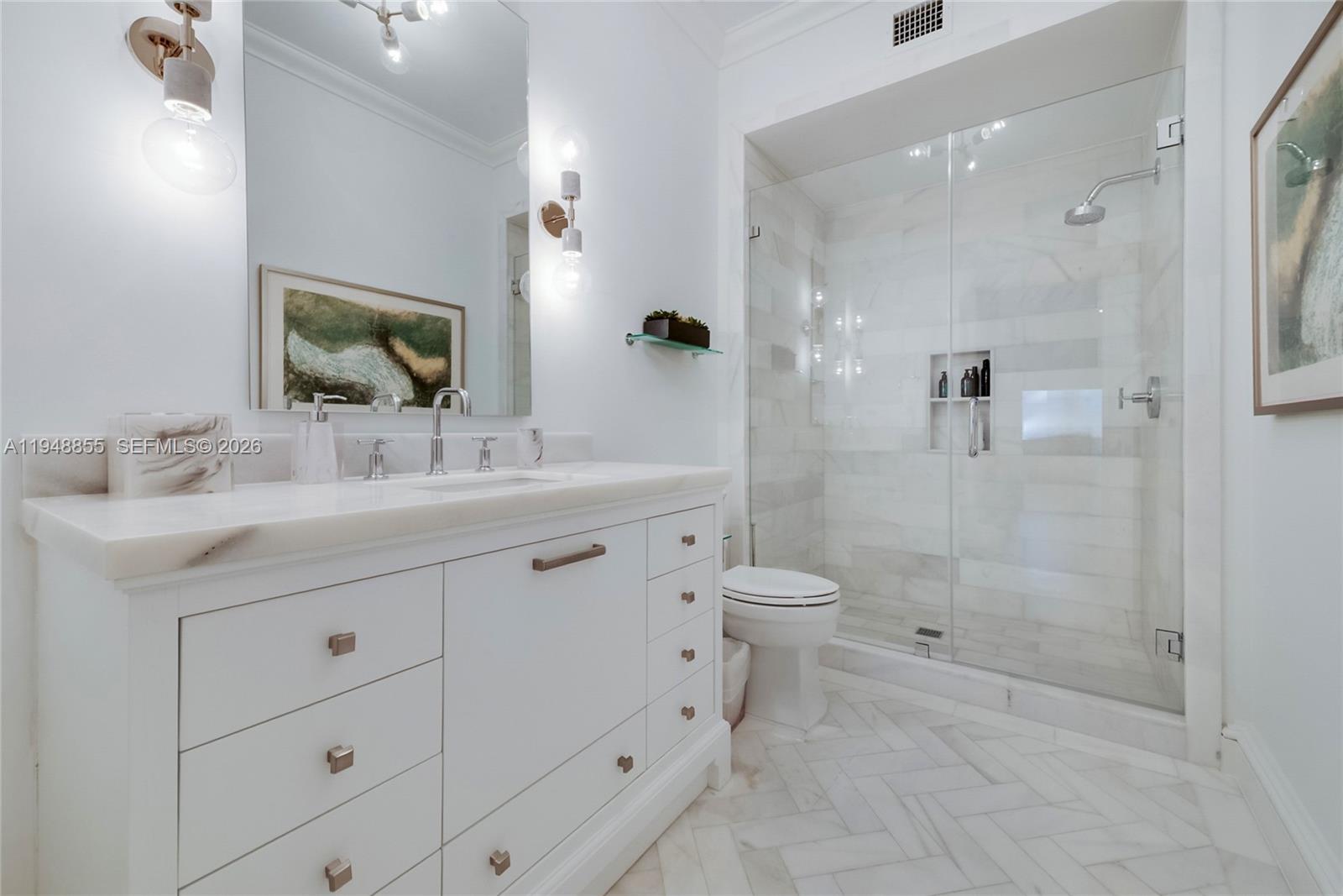 2615 Anderson Road Coral Gables, FL 33134 - Photo 24 of 28 a bathroom with a double vanity sink toilet and shower