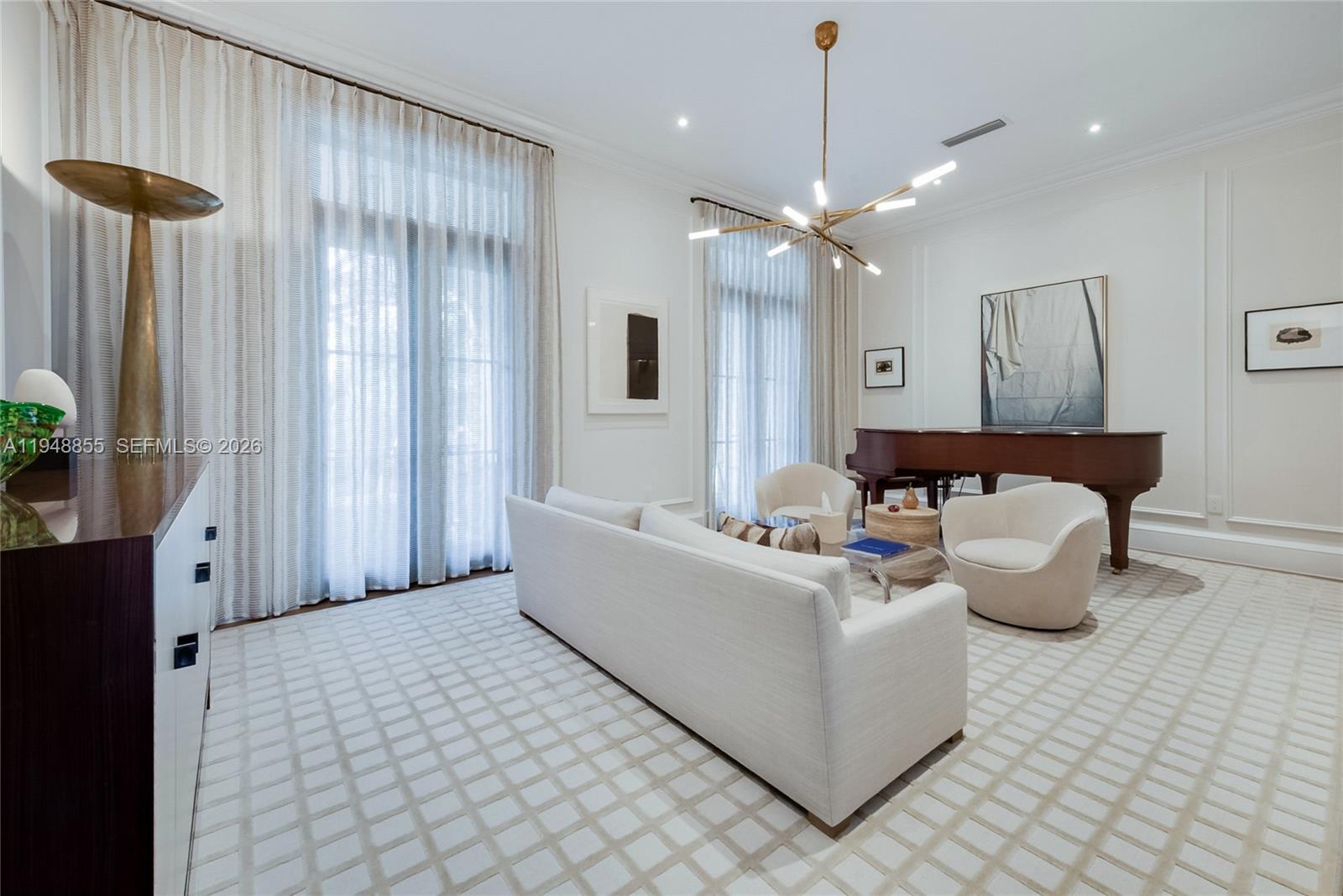 2615 Anderson Road Coral Gables, FL 33134 - Photo 3 of 28 a living room with furniture and a chandelier
