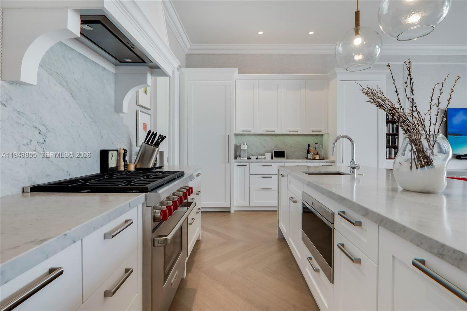 2615 Anderson Road Coral Gables, FL 33134 - Photo 10 of 28 a kitchen with stainless steel appliances a sink stove and cabinets