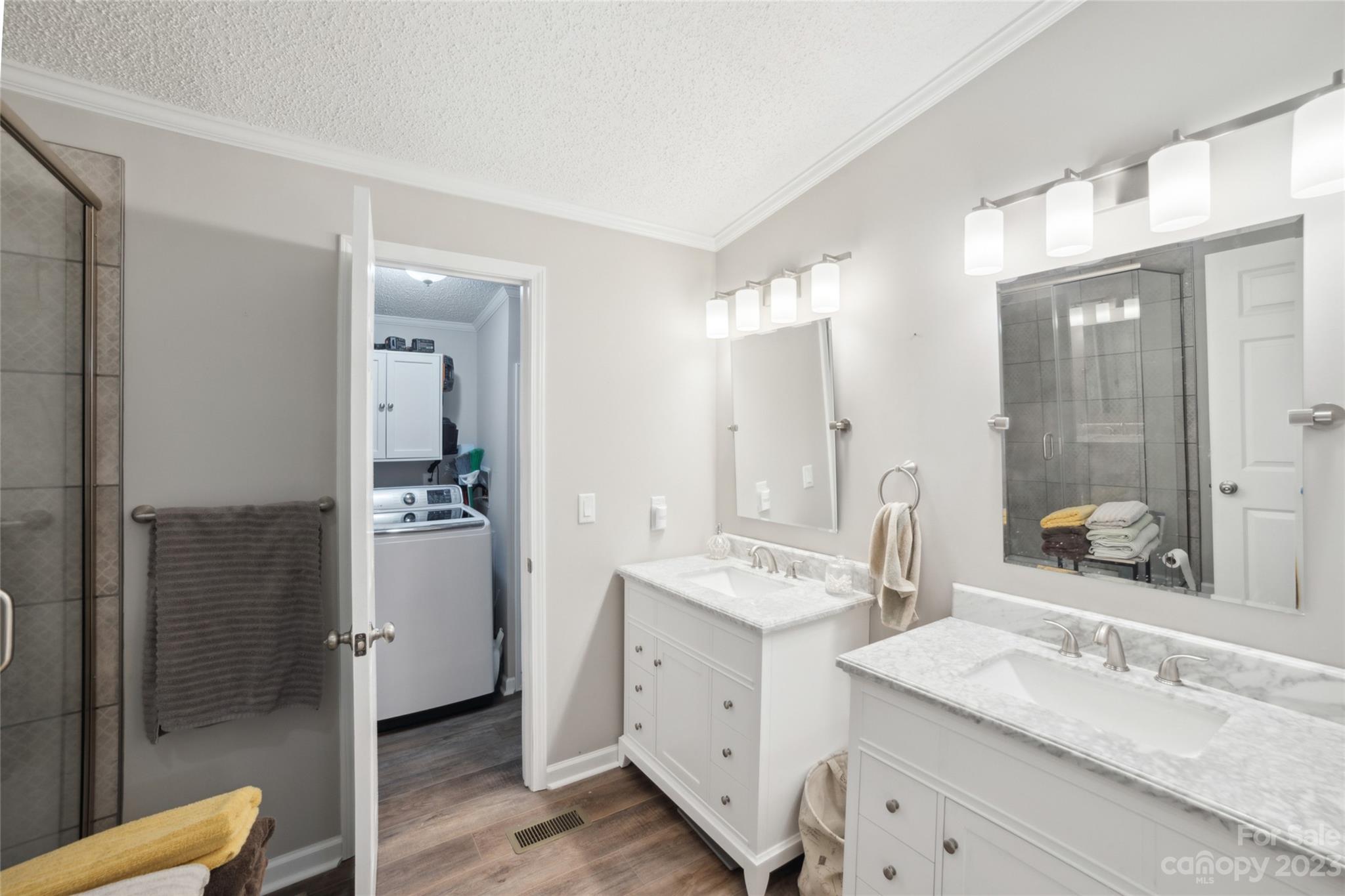 235 Amity Church Road Iron Station, NC 28080 - Photo 13 of 25 a bathroom with a double vanity sink mirror and shower