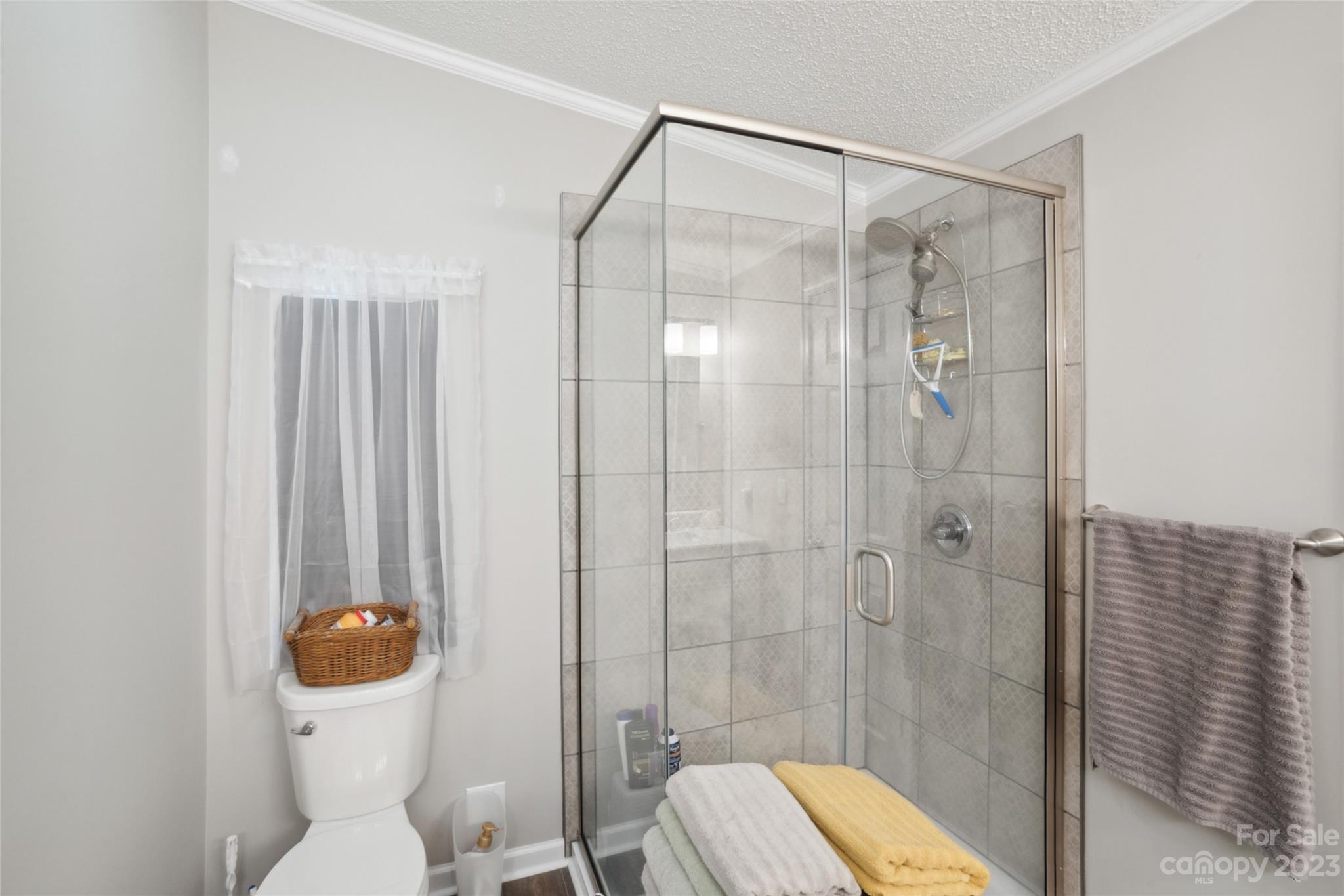 235 Amity Church Road Iron Station, NC 28080 - Photo 14 of 25 a bathroom with a shower and toilet