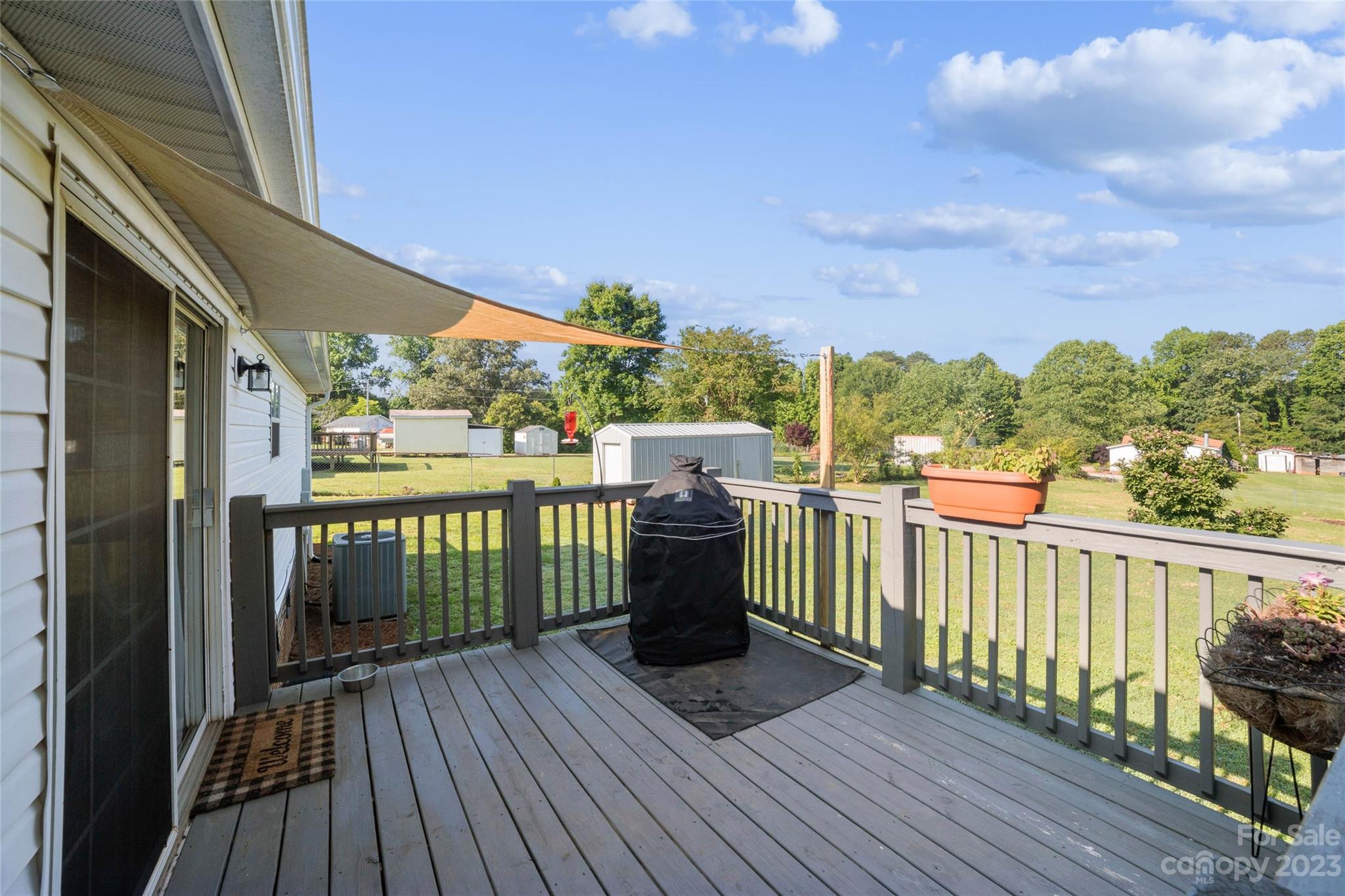 235 Amity Church Road Iron Station, NC 28080 - Photo 21 of 25 a view of a balcony with wooden floor