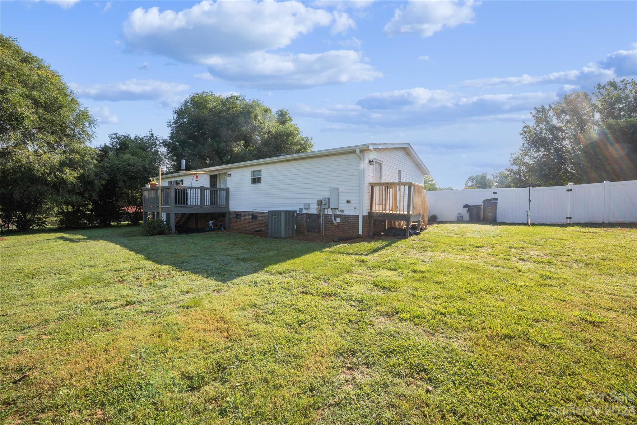 235 Amity Church Road Iron Station, NC 28080 - Photo 24 of 25 a view of a house with a yard