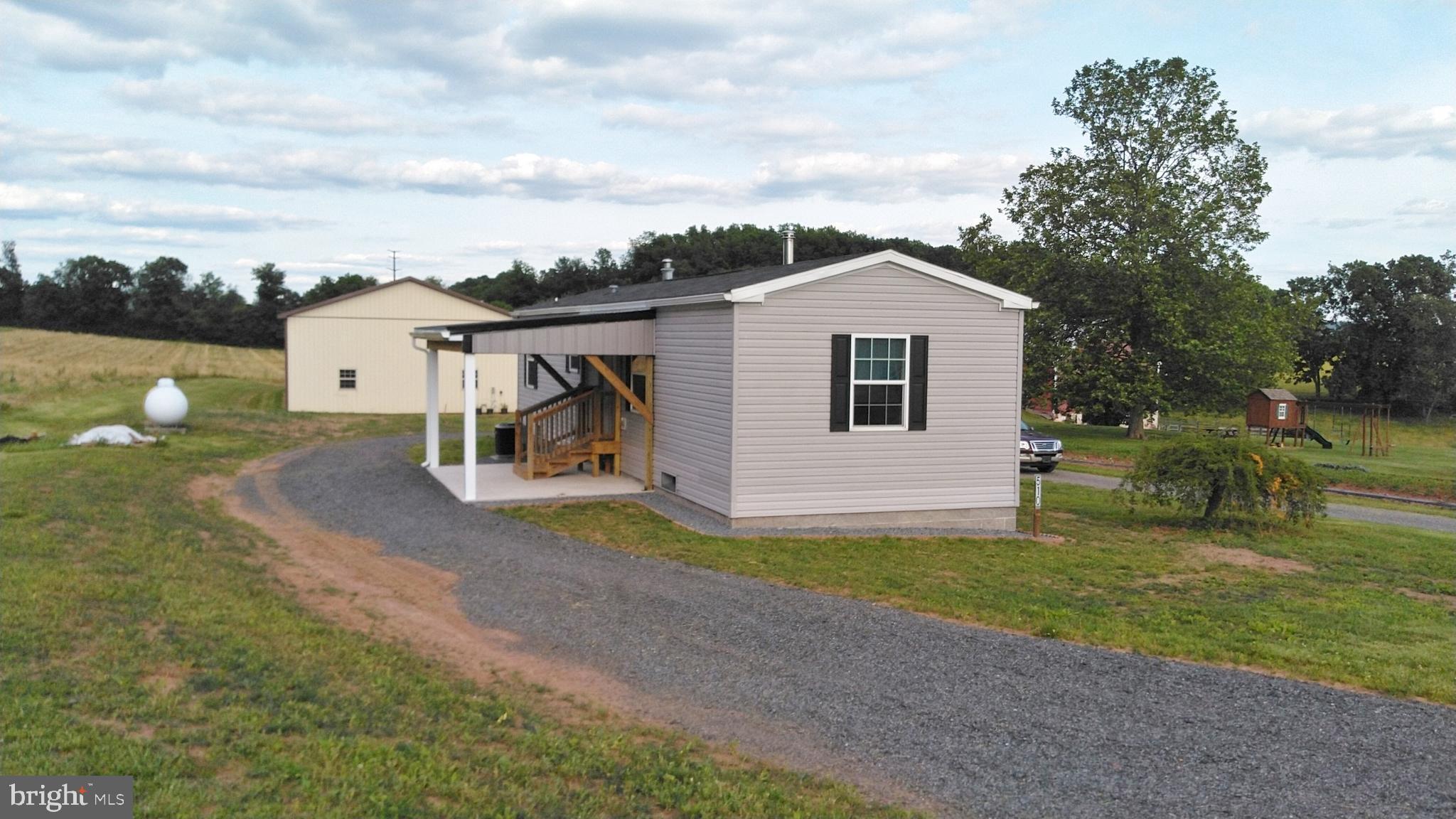 510 School Road Denver, PA 17517 - Photo 4 of 14 a house view with a garden space