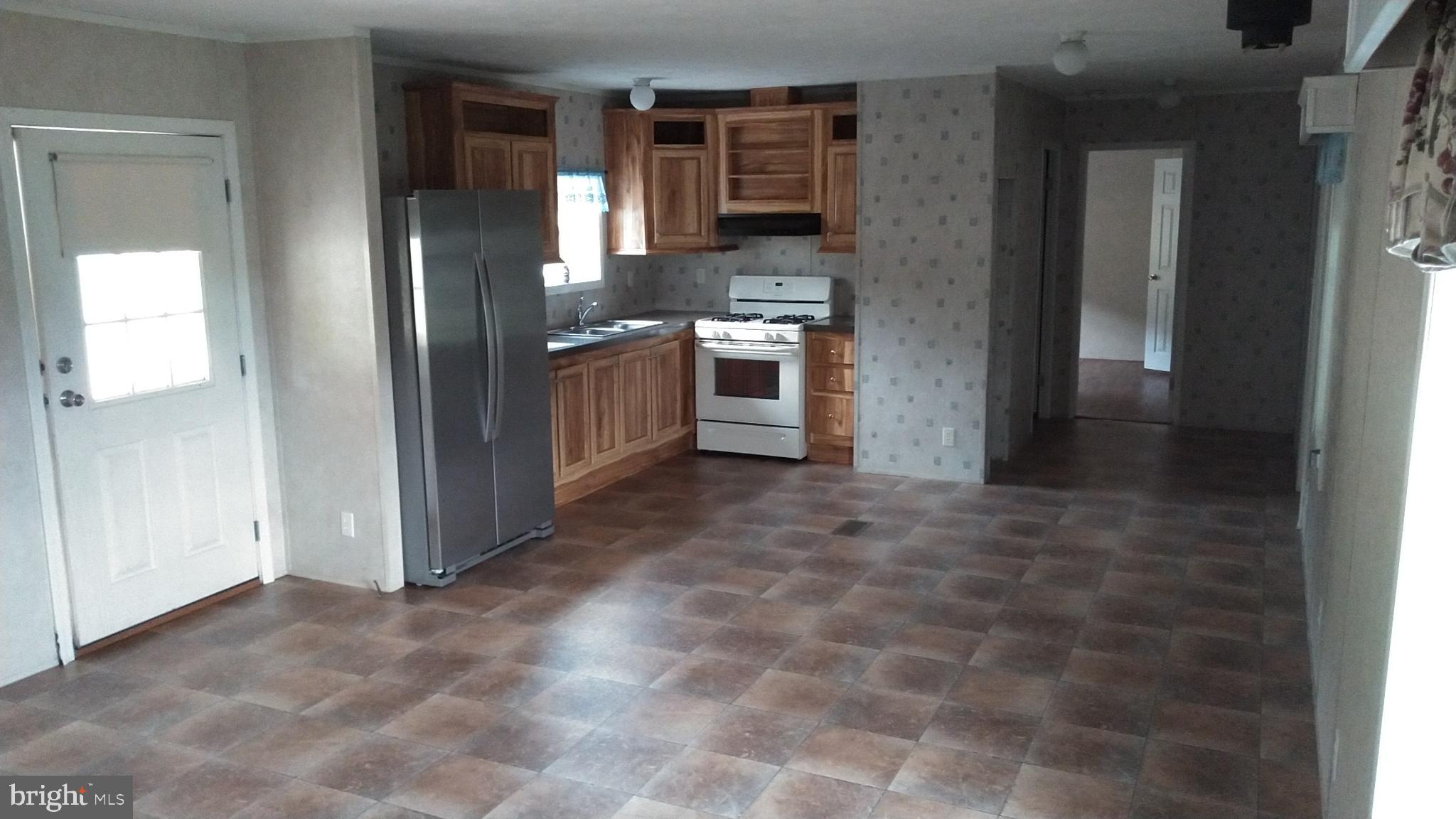 510 School Road Denver, PA 17517 - Photo 5 of 14 a kitchen with stainless steel appliances a refrigerator and a stove