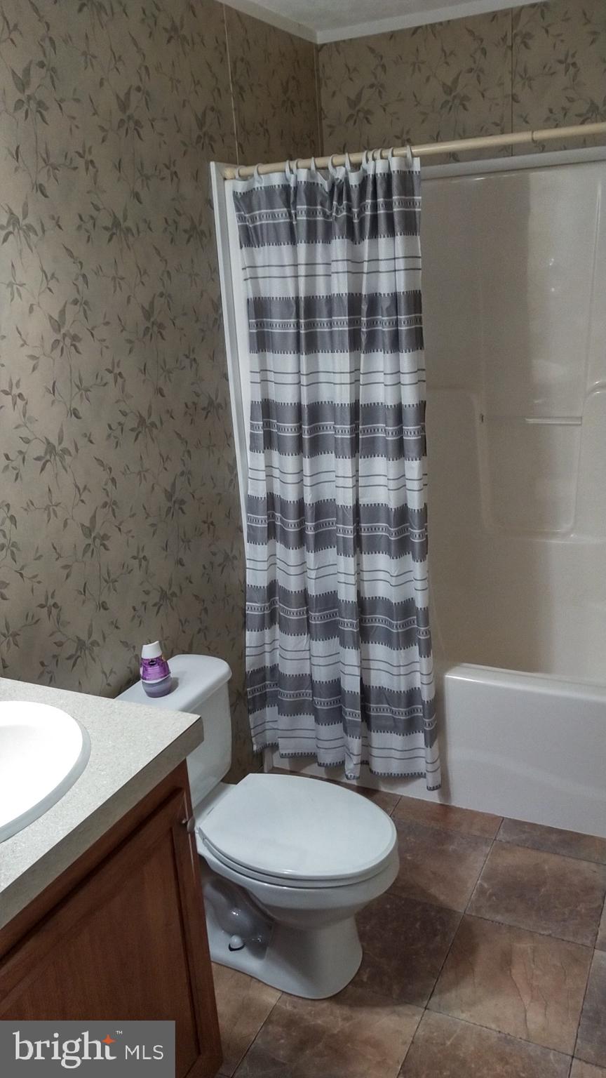 510 School Road Denver, PA 17517 - Photo 9 of 14 a bathroom with a sink a toilet and shower