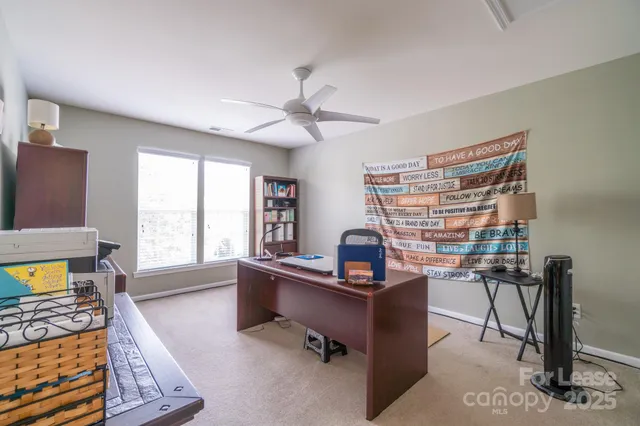 a workspace with furniture and a window