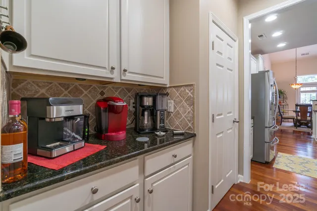 a kitchen with lots of refrigerator and cabinets
