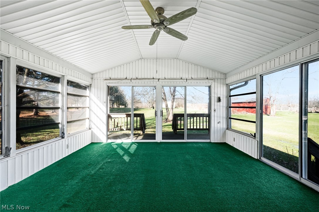 6452 Carsten Road Medina, OH 44256 - Photo 17 of 41 Unfurnished sunroom featuring vaulted ceiling, plenty of natural light, and ceiling fan